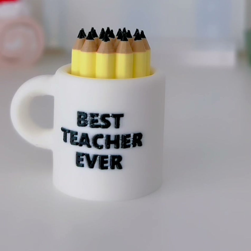 Best Teacher Mug Clicker with readable Best Teacher Ever lettering, photographed in lovely day studio