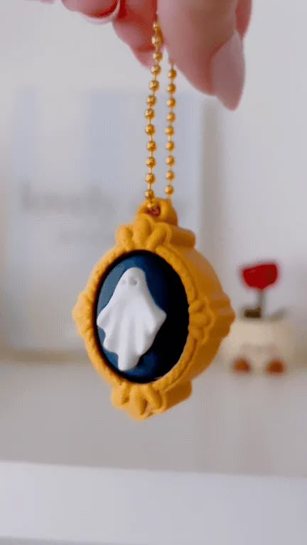 Ghost in Gold Frame Clicker Keychain demonstration